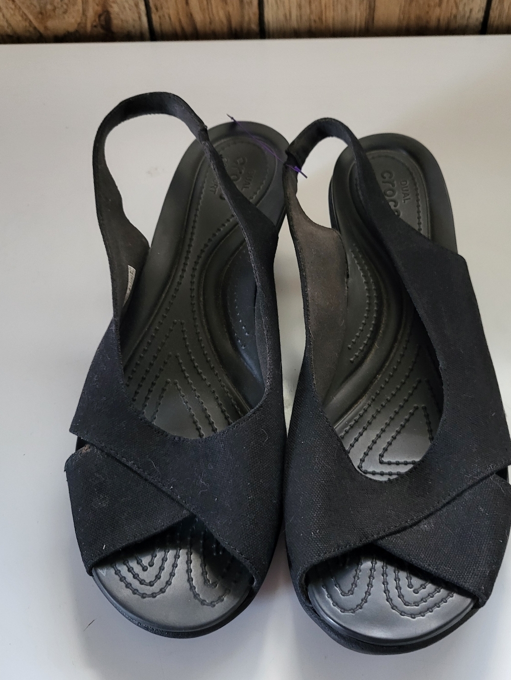 These Crocs Black Women's Sling Back Wedge Sandals in size 11W are a stylish and